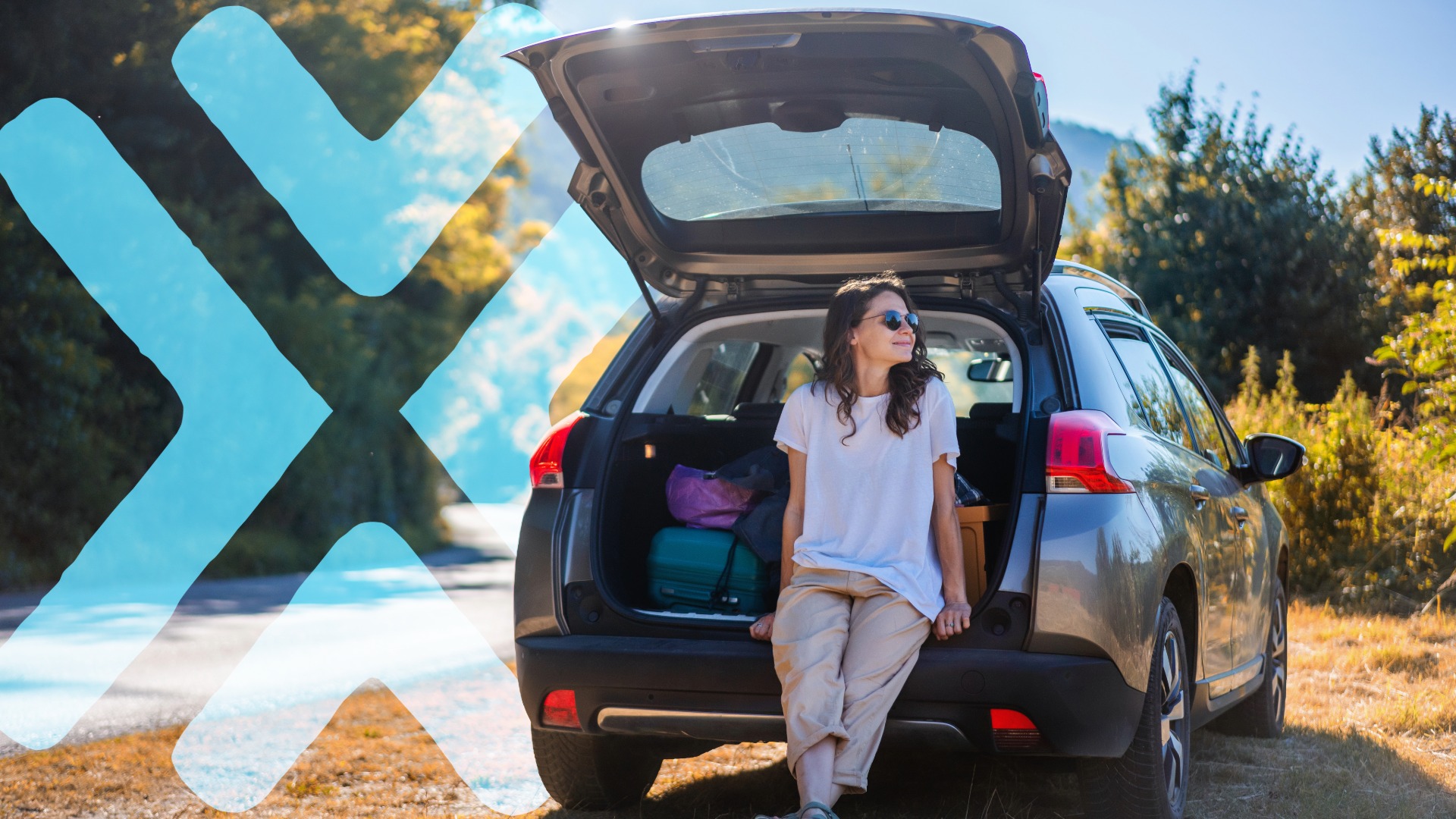 woman sitting on car