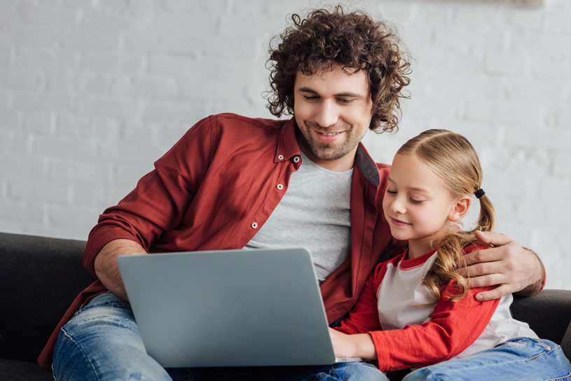 dad and daughter with laptop